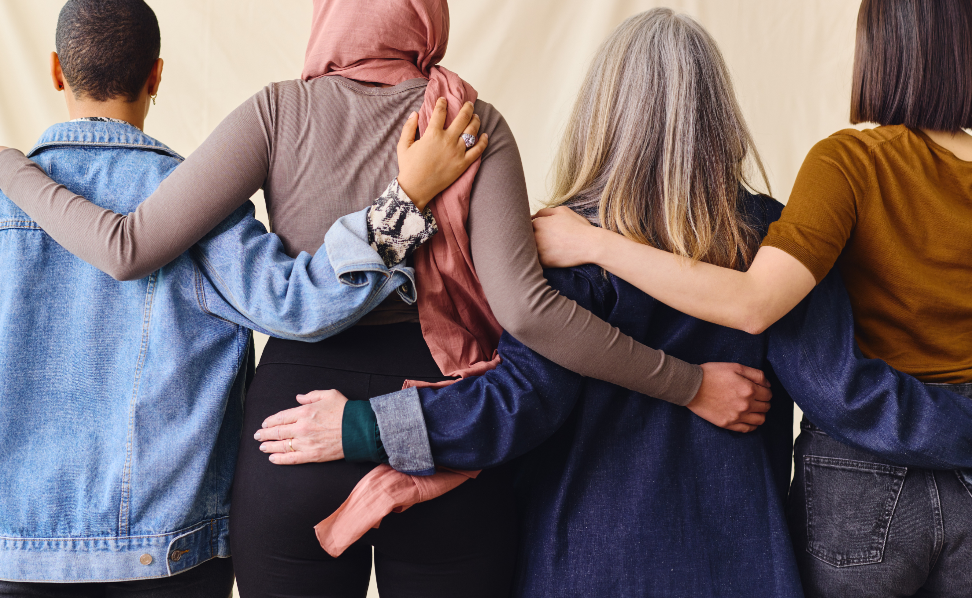 Women with their arms around each other celebrating international womens day